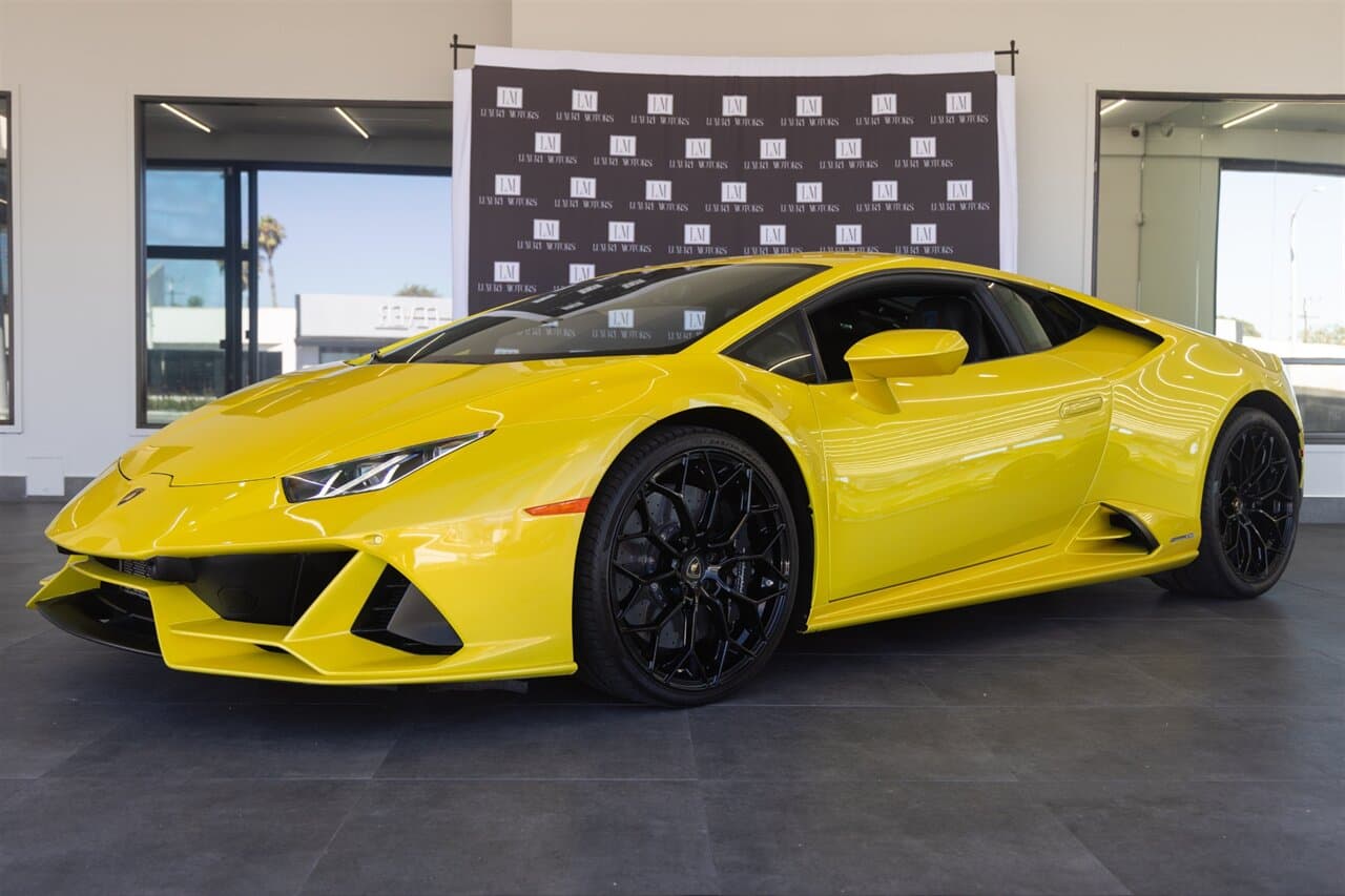 Yellow Lamborghini Huracán in a dealership showroom